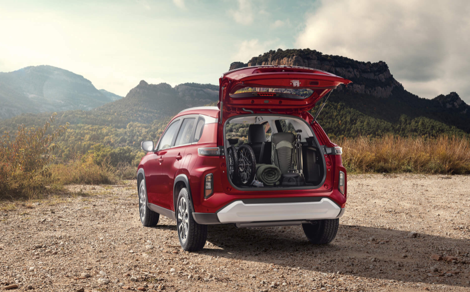 A red Suzuki Grand Vitara with its back hatch open